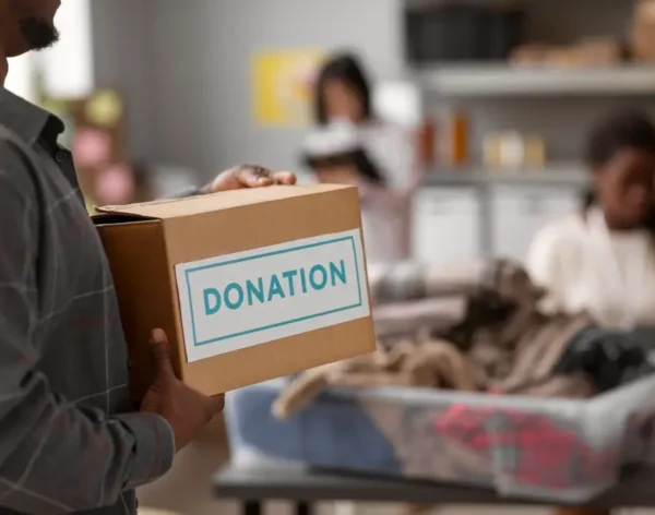 volunteer-helping-with-donation-box